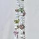 Full view of the handmade Antique Garden beaded plant hanger, showcasing its vintage-inspired design.