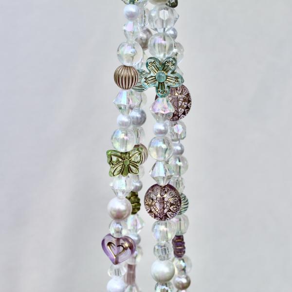 Full view of the handmade Antique Garden beaded plant hanger, showcasing its vintage-inspired design.