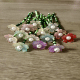 A charming beaded flower bouquet magnet used as a decorative office supply on a magnetic board.