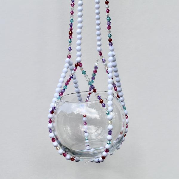 The complete Berry Frost beaded plant hanger, a colorful home decor accent with vibrant jewel tones.