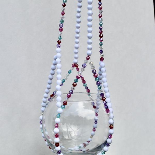 An eye-catching shot showing the sparkle of ruby and teal beads on the Berry Frost plant accessory.