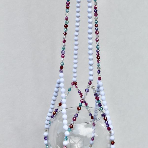 A unique, handmade gift for plant lovers, featuring a colorful mix of frosted and crystal beads.