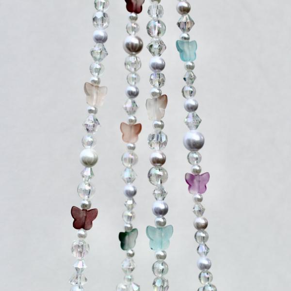 This magical plant hanger catching the light, showcasing its function as a beautiful, light-catching home accessory.