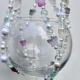 A detail shot of the handcrafted beadwork, celebrating nature with a soft and sweet pastel color palette.