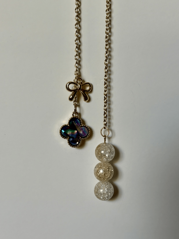 Full view of the Moon Bow and Clover Charm.