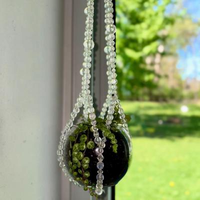 The complete Moonlit Dew beaded plant hanger, an ethereal and minimalist decor piece.
