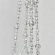 A detail shot emphasizing the clean, glass-like texture of the minimalist beaded design.