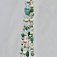 The complete Sage & Sand beaded plant hanger, showcasing its earthy, neutral, and organic elegance.