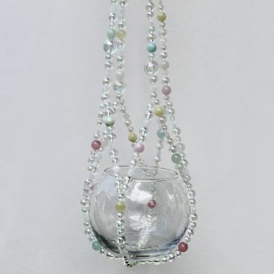 The complete Sugar Cloud beaded plant hanger, a whimsical piece with a dreamy pastel color palette.