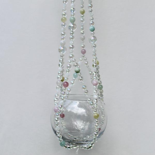 A detail shot of the whimsical beadwork, featuring frosted glass and soft pastel tones.